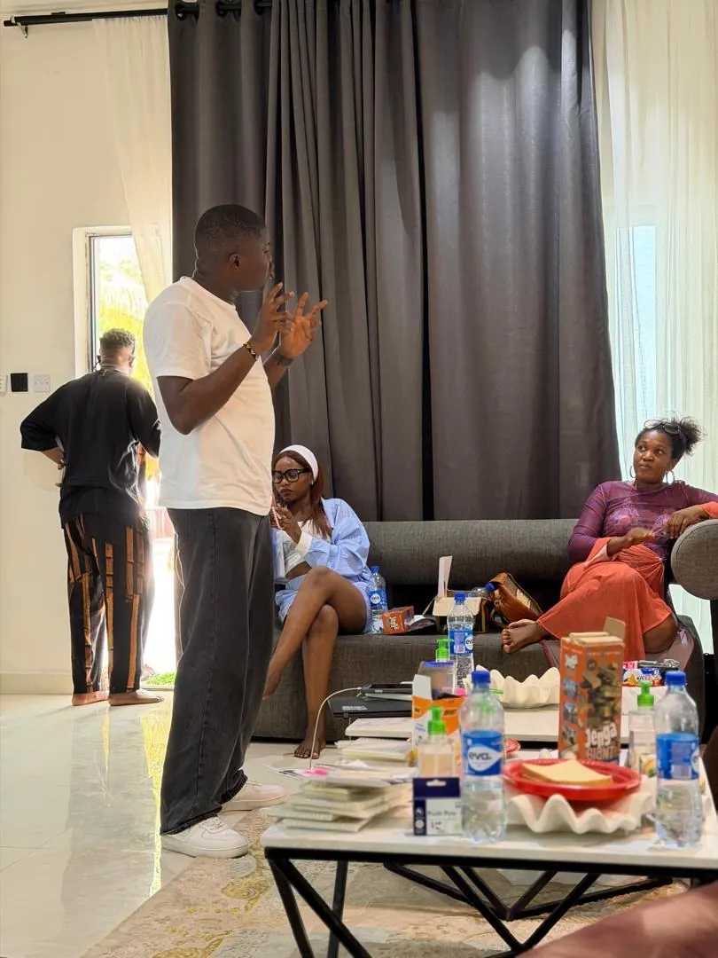Ayodeji explaining a concept to participants during a workshop